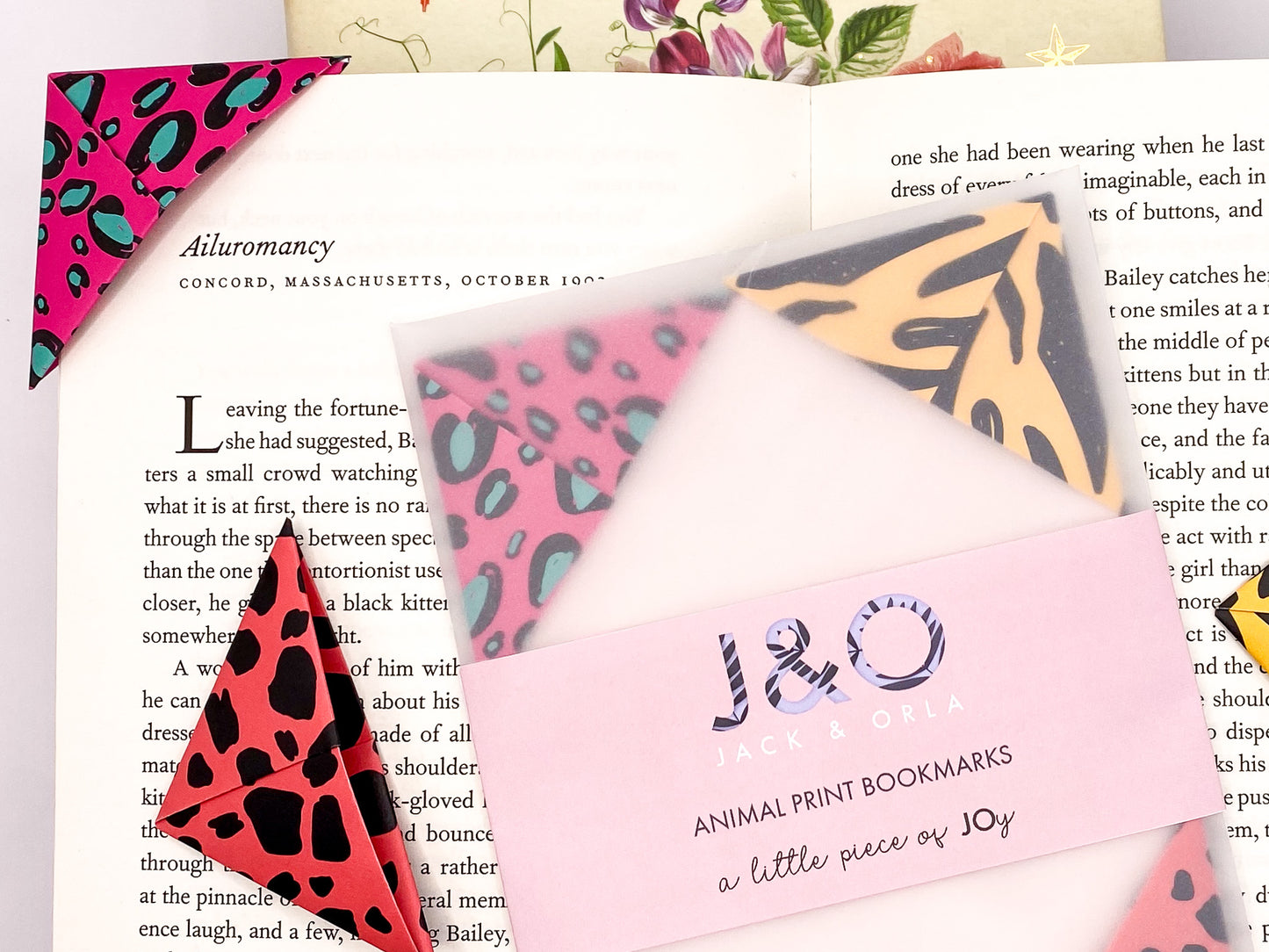 An open book with a selection of animal print origami bookmarks