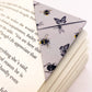 Origami insect bookmark on the corner of a book