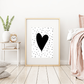 A framed monochrome art print featuring a black heart by Jack & Orla