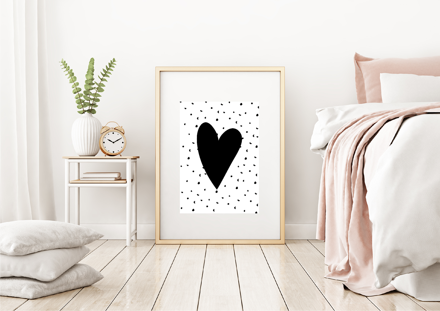 A framed monochrome art print featuring a black heart by Jack & Orla