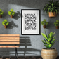 A framed monochrome typography art print saying 'wild' with a zebra print background by Jack & Orla