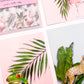 Close-up of pastel tropics postcards by Jack & Orla